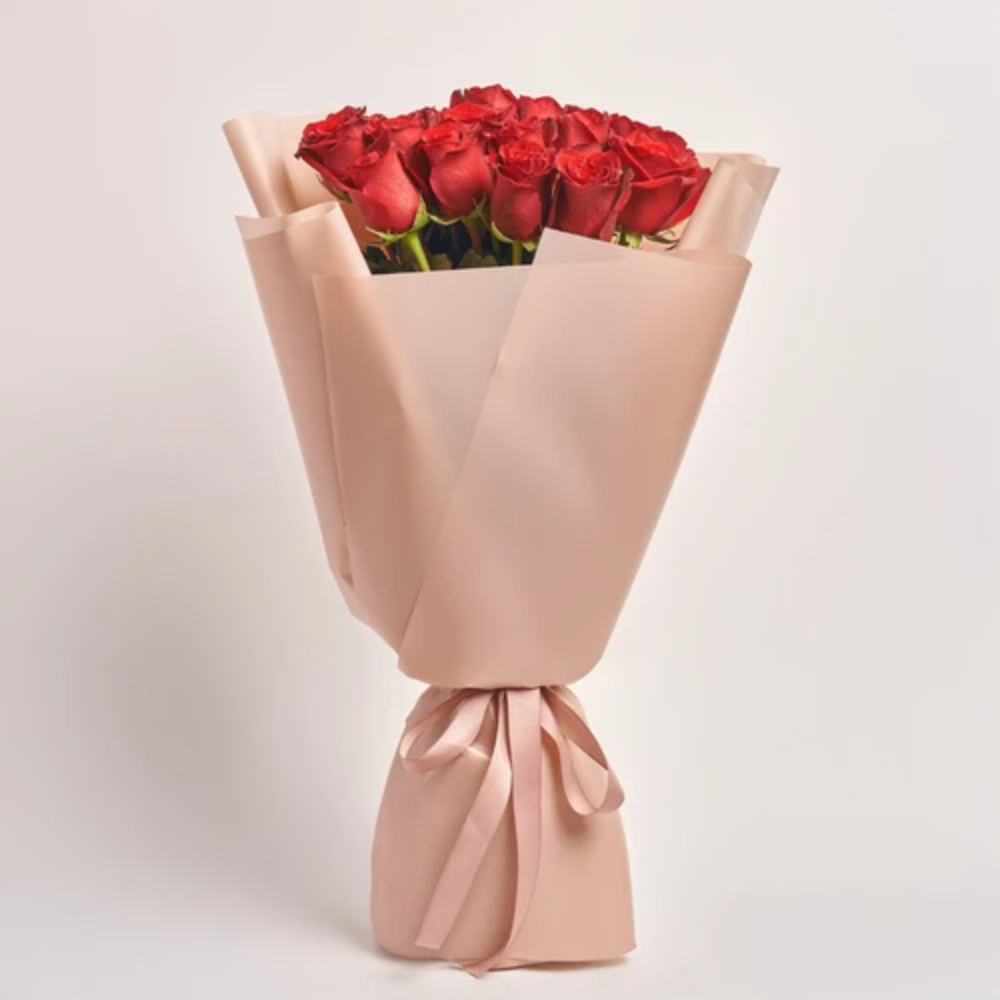 Classic red rose bouquet wrapped in elegant beige paper with a matching ribbon
