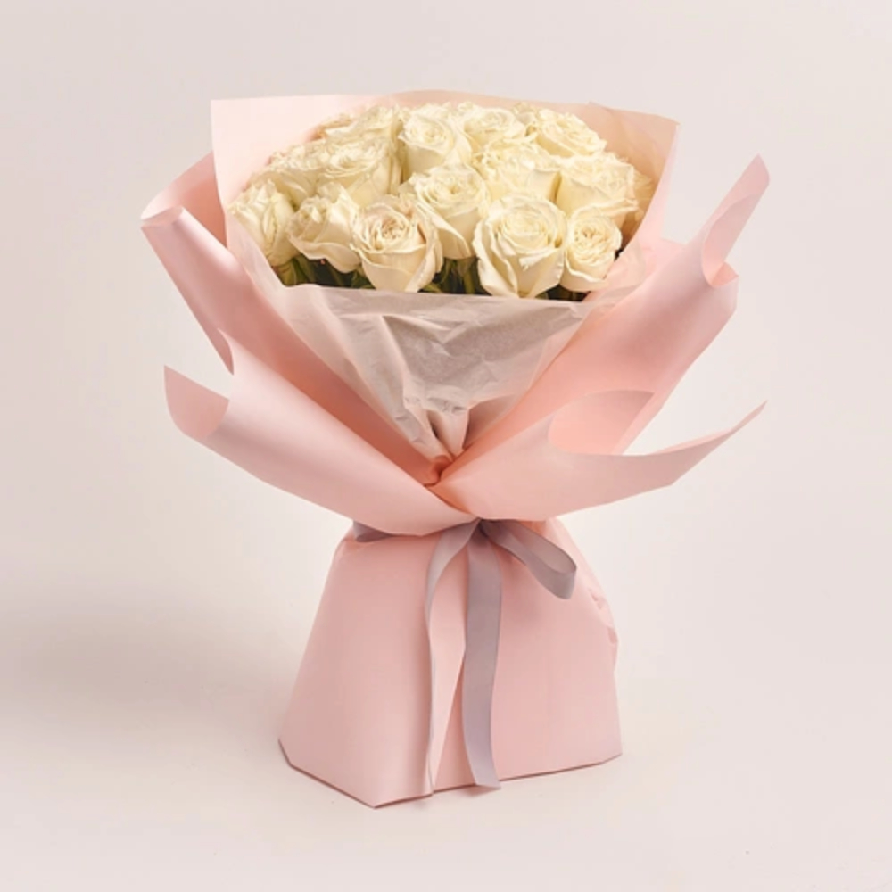 Fresh bouquet of pink roses wrapped in elegant green paper with a soft pink ribbon, perfect for romantic gifting and special occasions.