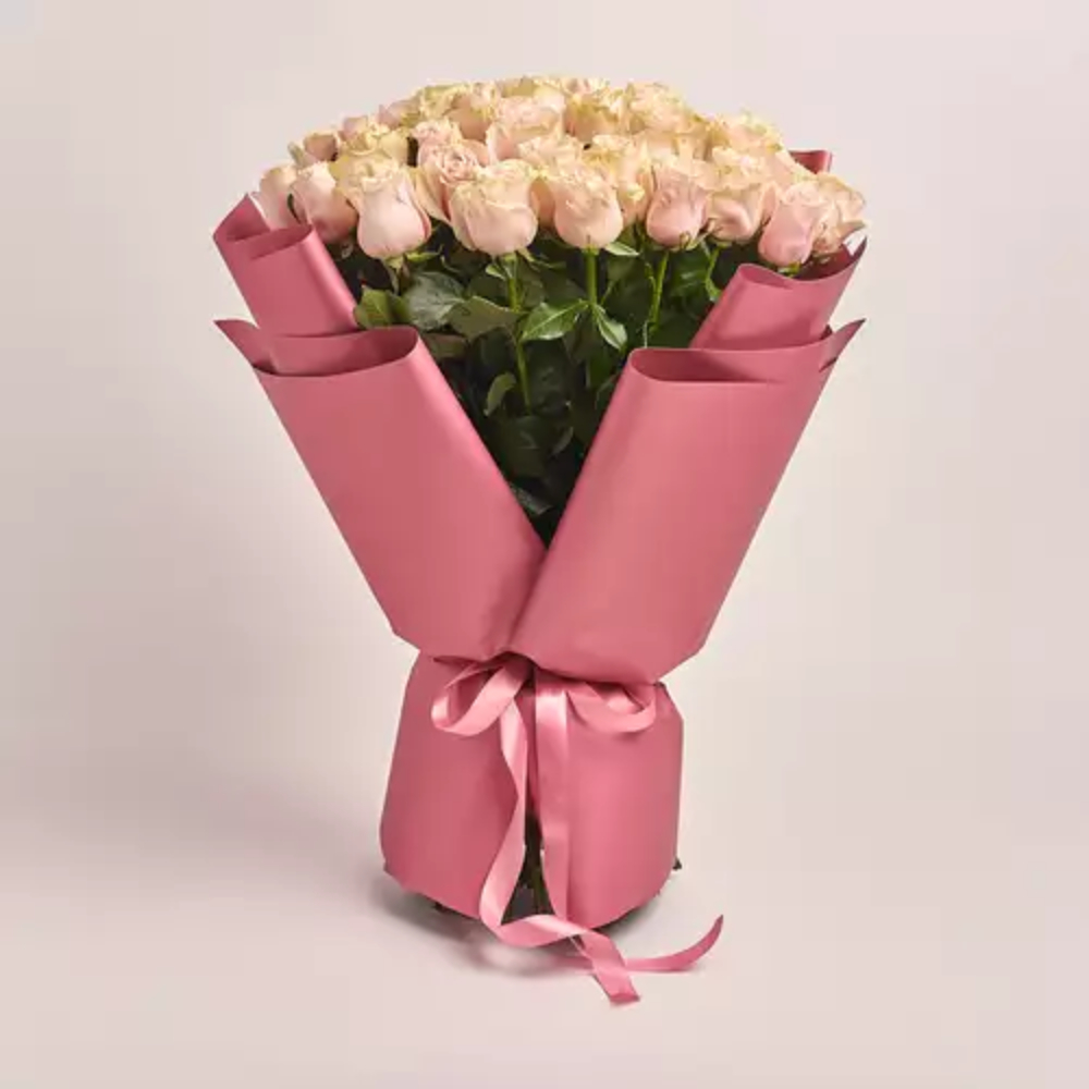 Elegant bouquet of fresh pink roses wrapped in premium pastel paper with a soft ribbon, perfect for romantic gifting, anniversaries, and same-day flower delivery in Dubai.