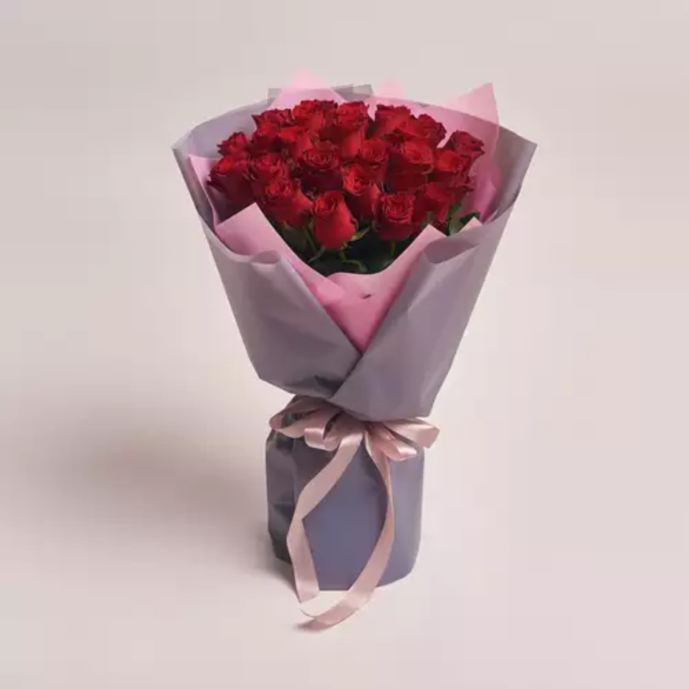 Premium bouquet of fresh red roses wrapped in grey and pink paper with a satin ribbon, luxury flower gift by Favish Blooms Dubai