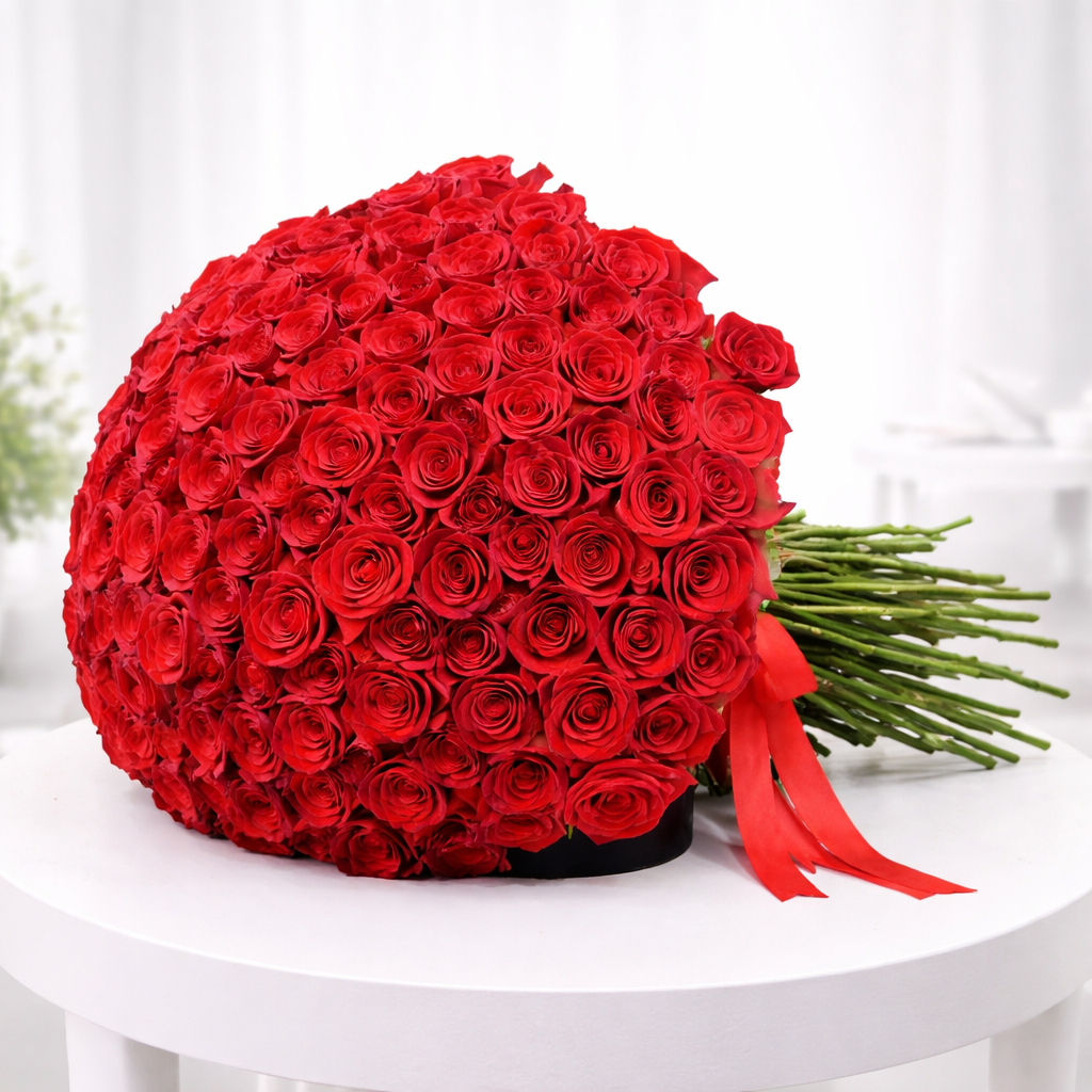 Large dome red rose bouquet lying on table
