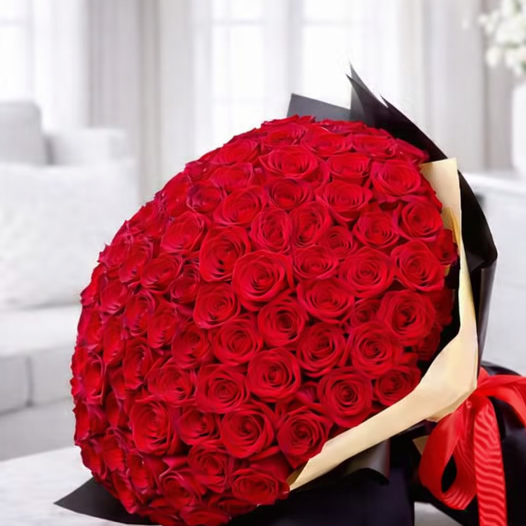 Close-up of premium red roses arranged in round bouquet