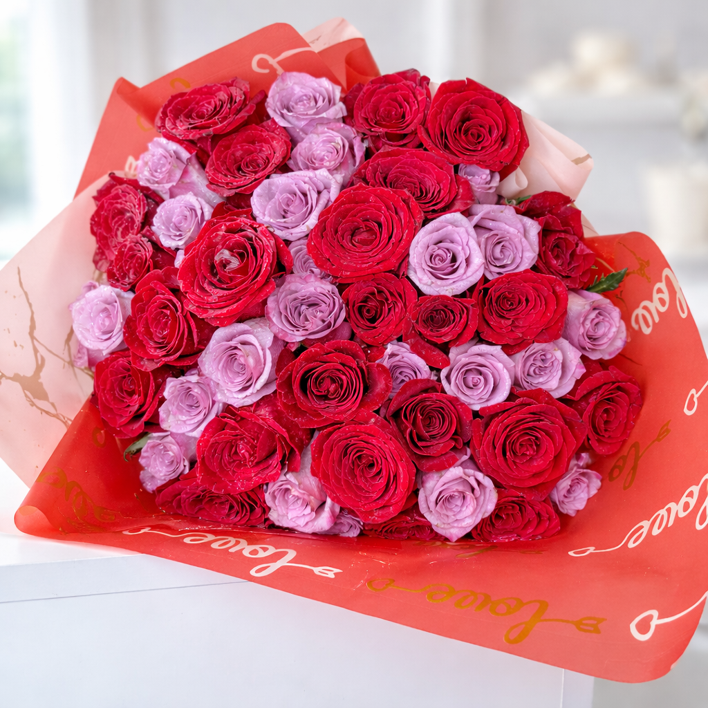 Close-up of mixed red and pink roses bouquet with decorative wrapping