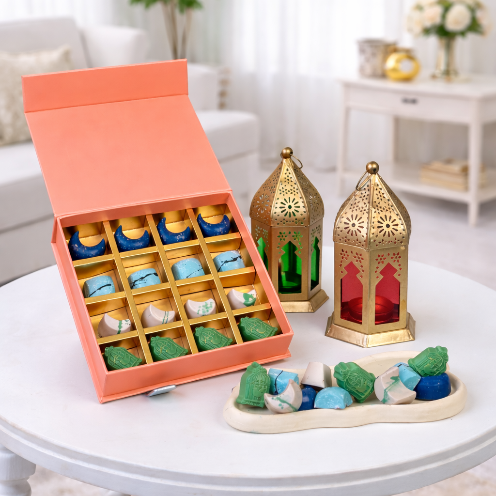 The display features deep magenta roses, a prominent pink lily, pale peach roses, and light green carnations.