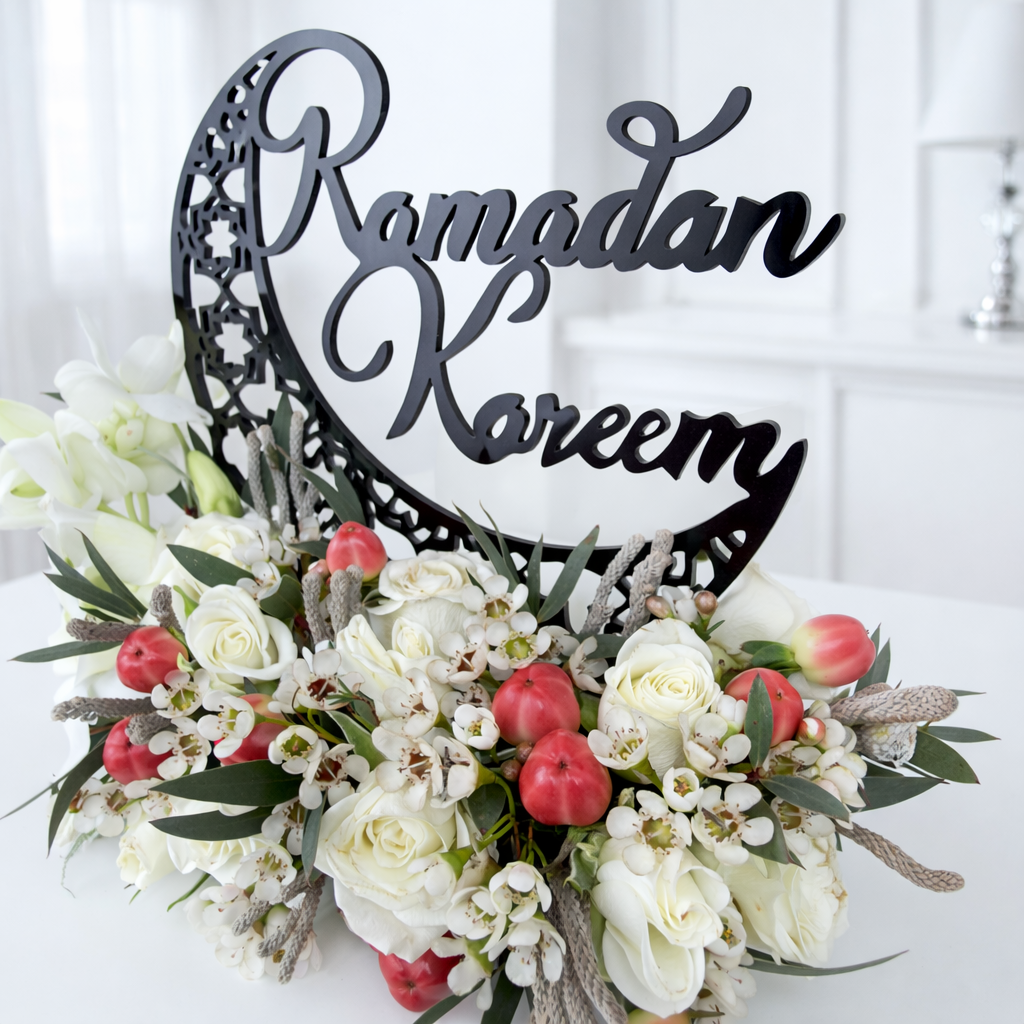 Close-up Ramadan Kareem flower arrangement with white roses and berries