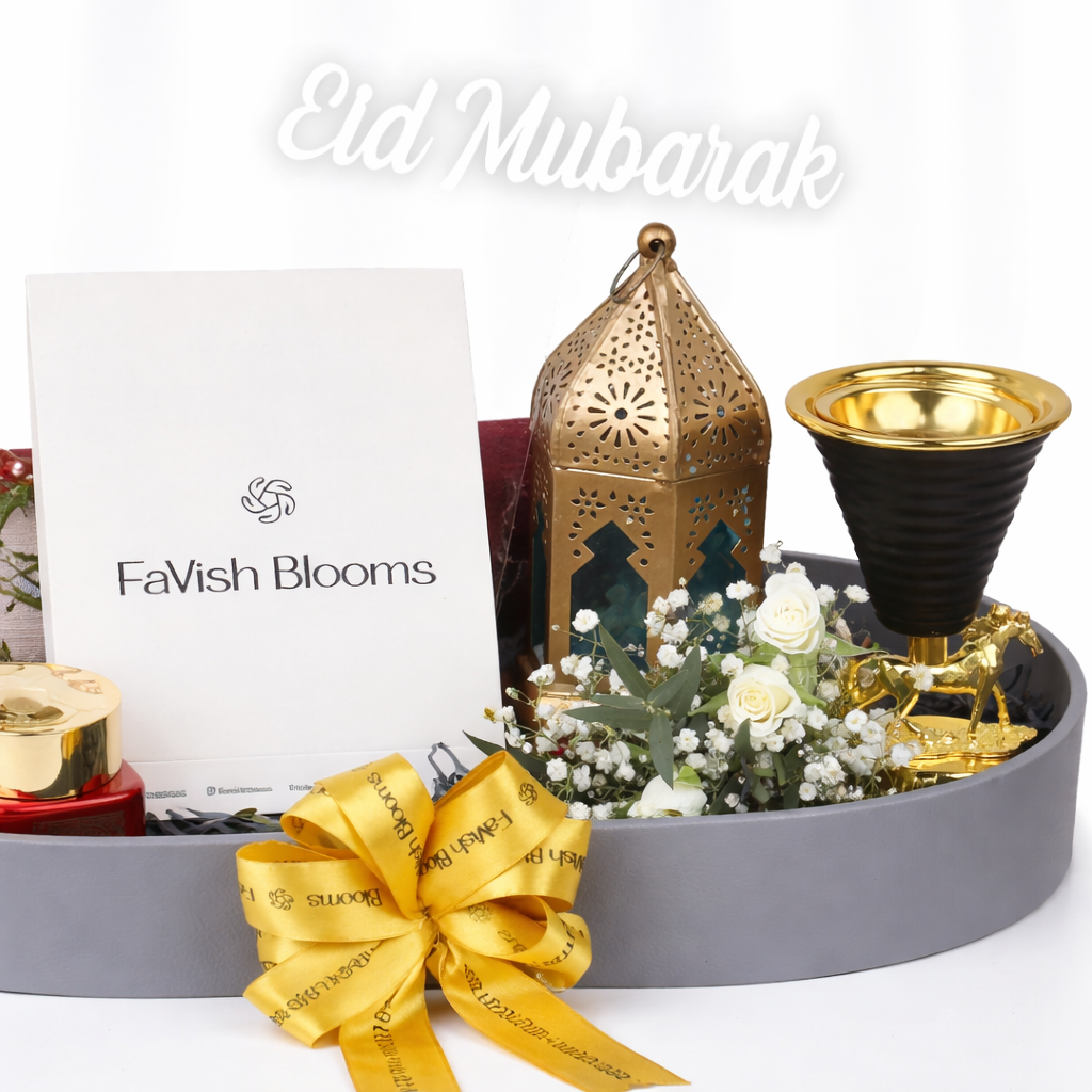 FaVish Blooms Eid Mubarak gift tray with gold lantern, oud burner, white flowers, and gold horse figurine.