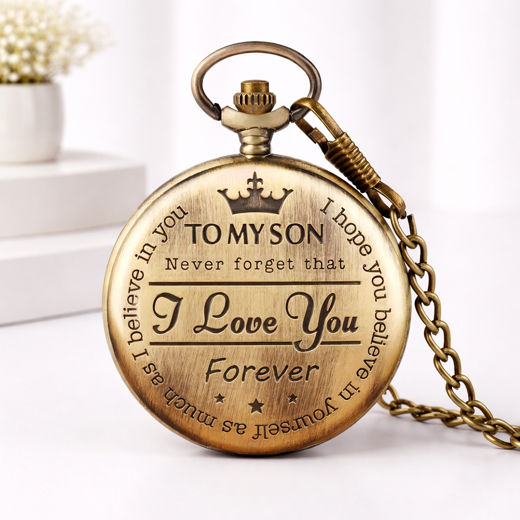 Back of antique bronze pocket watch engraved with a crown and "To My Son – Never forget that I Love You Forever