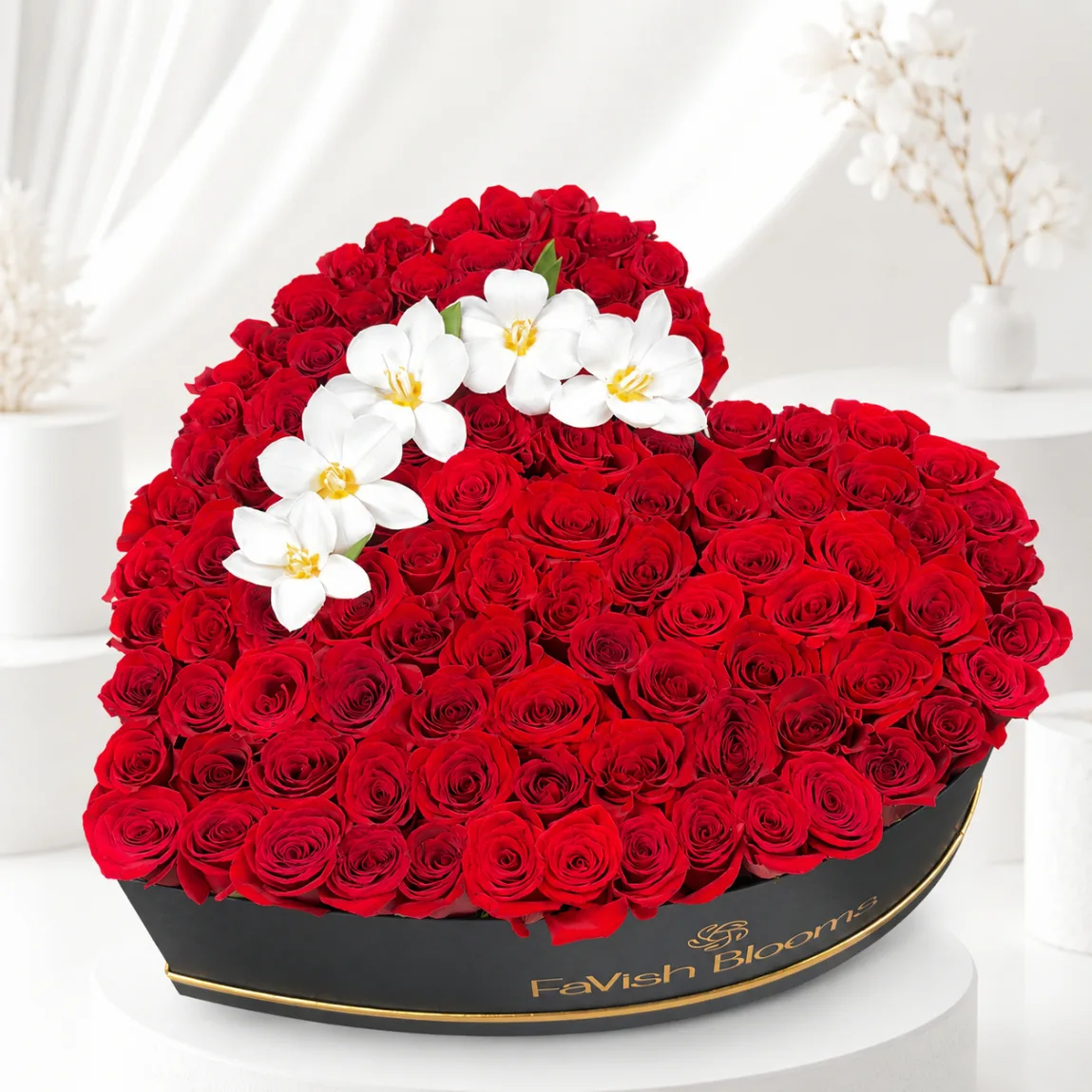Red rose heart arrangement with white flower design