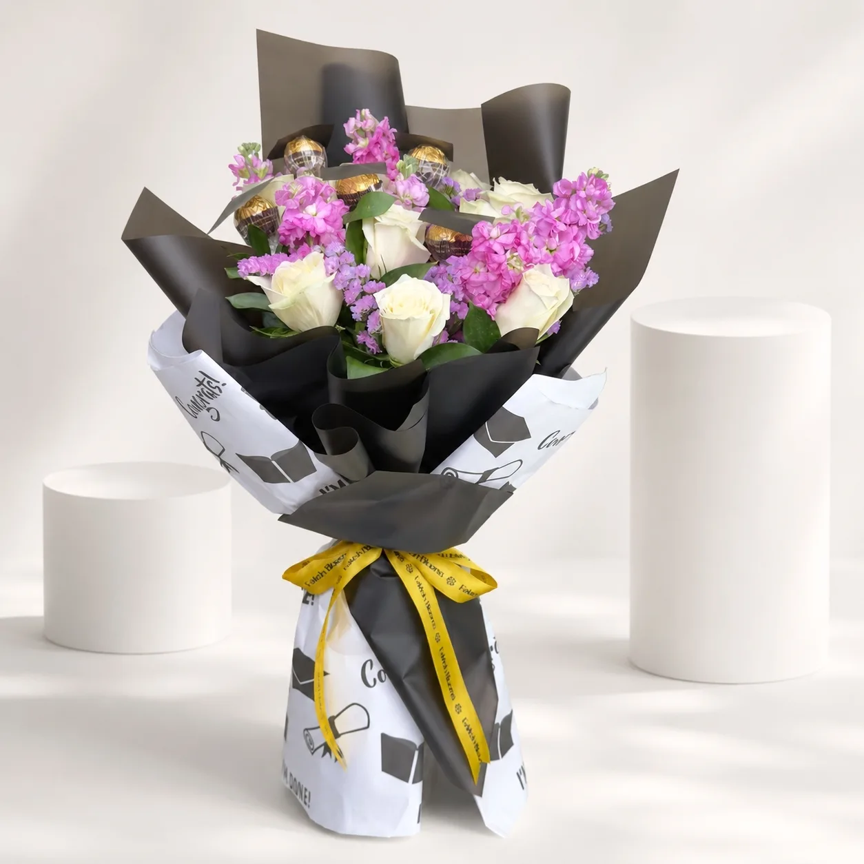 Luxury mixed flower and Ferrero Rocher bouquet with black wrapping by FaVish Blooms