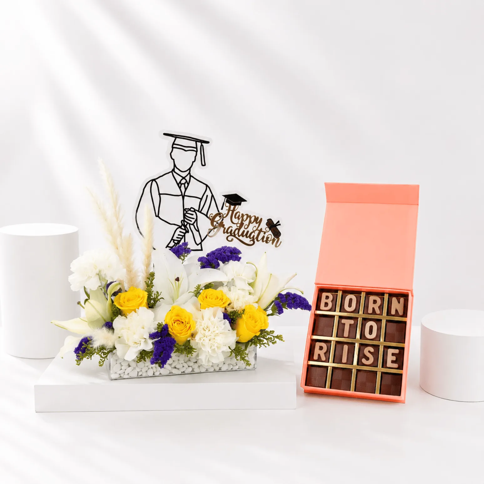 Born To Rise graduation flower arrangement with chocolate gift box.