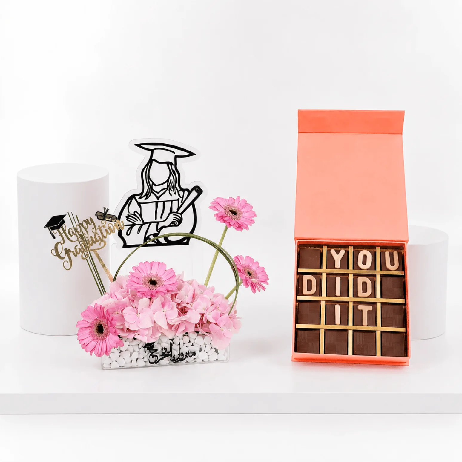 Graduation flower arrangement with “You Did It” chocolate gift box.